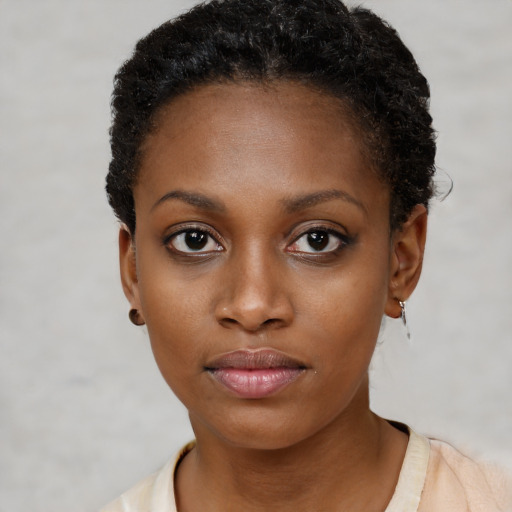 Neutral black young-adult female with short  brown hair and brown eyes