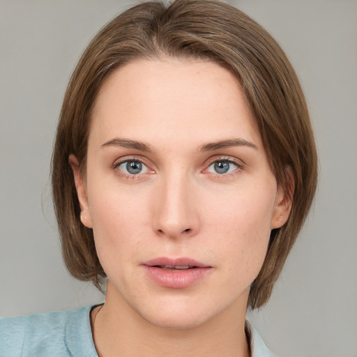 Neutral white young-adult female with medium  brown hair and green eyes