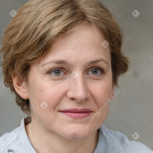 Joyful white adult female with medium  brown hair and grey eyes