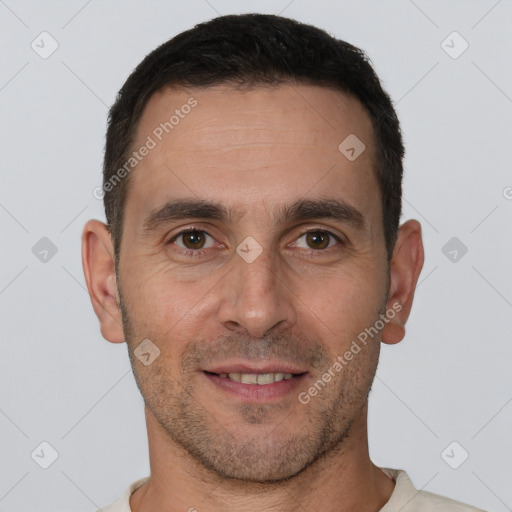 Joyful white young-adult male with short  brown hair and brown eyes