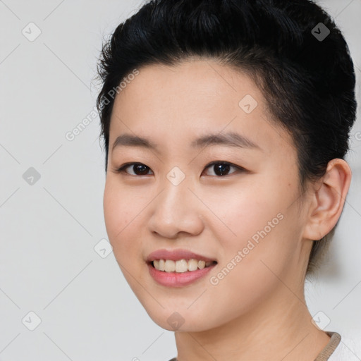 Joyful asian young-adult female with short  black hair and brown eyes