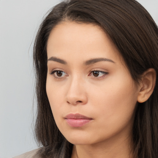 Neutral white young-adult female with long  brown hair and brown eyes