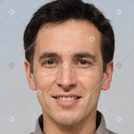 Joyful white adult male with short  brown hair and brown eyes