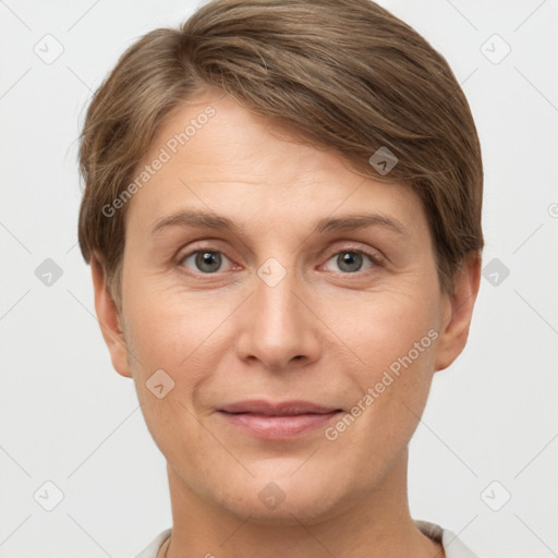 Joyful white young-adult female with short  brown hair and grey eyes