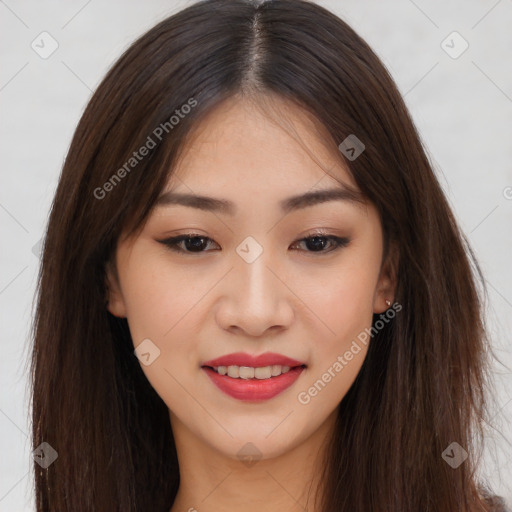 Joyful asian young-adult female with long  brown hair and brown eyes