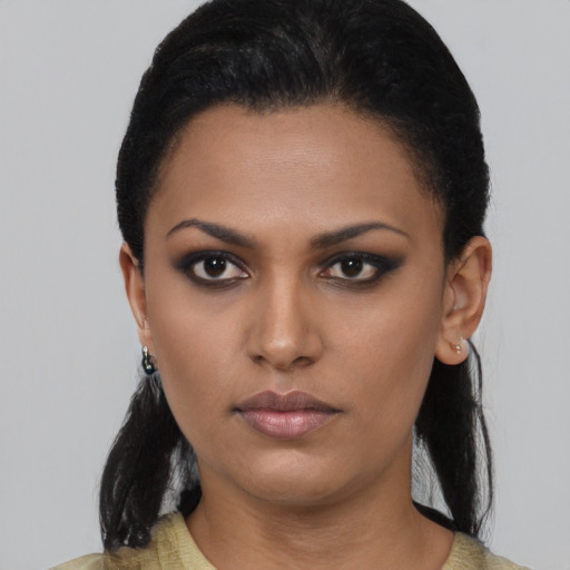 Neutral latino young-adult female with short  black hair and brown eyes