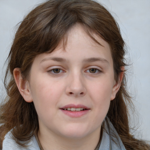 Joyful white child female with medium  brown hair and grey eyes