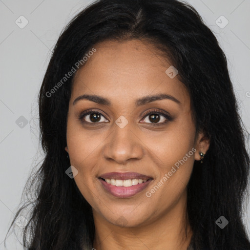 Joyful black young-adult female with long  brown hair and brown eyes