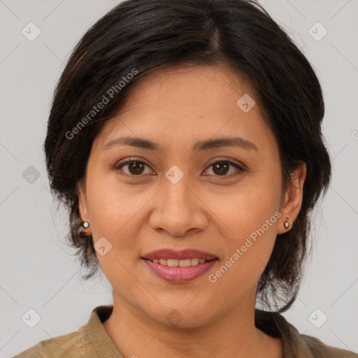 Joyful asian adult female with medium  brown hair and brown eyes