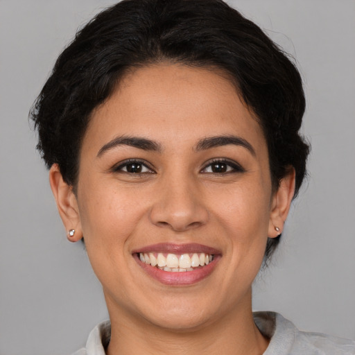 Joyful white young-adult female with short  brown hair and brown eyes