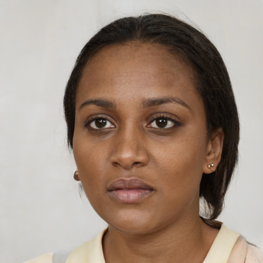 Neutral black young-adult female with medium  black hair and brown eyes