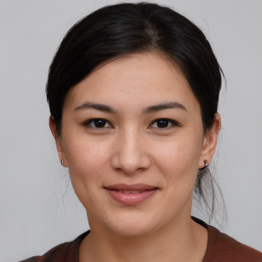 Joyful white young-adult female with medium  brown hair and brown eyes