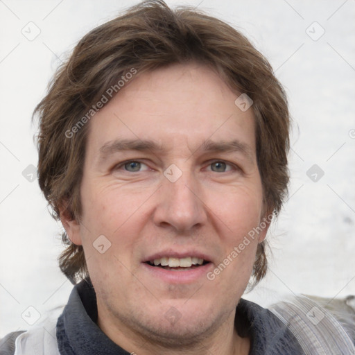 Joyful white adult male with short  brown hair and grey eyes