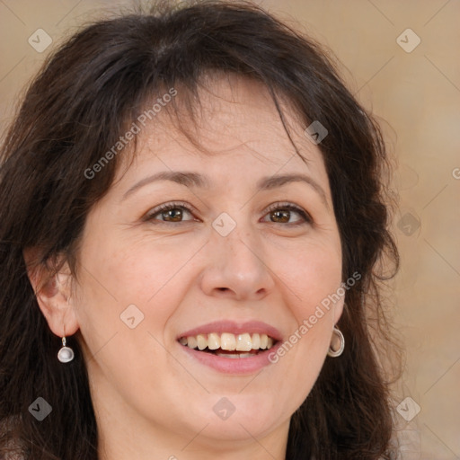Joyful white adult female with long  brown hair and brown eyes