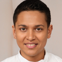 Joyful latino young-adult male with short  brown hair and brown eyes