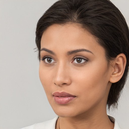 Neutral white young-adult female with medium  brown hair and brown eyes