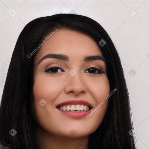 Joyful latino young-adult female with long  black hair and brown eyes