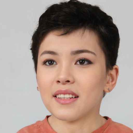Joyful asian young-adult female with short  brown hair and brown eyes