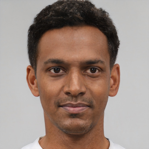 Neutral black young-adult male with short  black hair and brown eyes