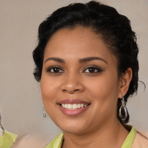 Joyful latino young-adult female with short  brown hair and brown eyes