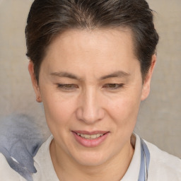 Joyful white adult female with short  brown hair and brown eyes