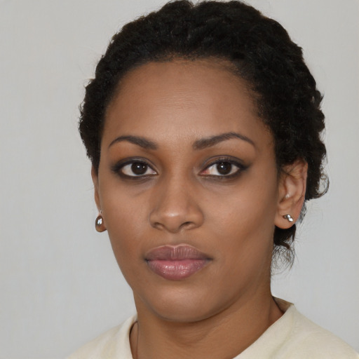 Neutral black young-adult female with short  black hair and brown eyes