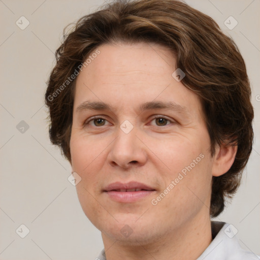 Joyful white adult female with medium  brown hair and green eyes