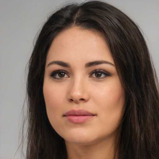 Neutral white young-adult female with long  brown hair and brown eyes