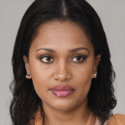 Joyful black young-adult female with medium  brown hair and brown eyes