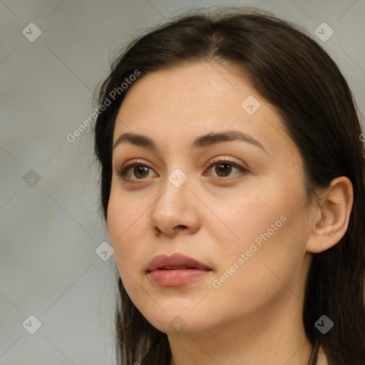 Neutral white young-adult female with long  brown hair and brown eyes