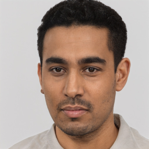 Neutral latino young-adult male with short  black hair and brown eyes