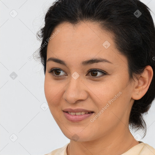 Joyful latino young-adult female with medium  brown hair and brown eyes