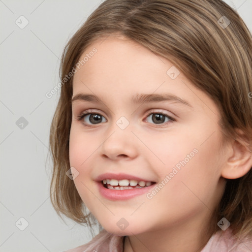 Joyful white child female with medium  brown hair and brown eyes