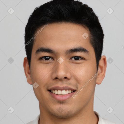 Joyful asian young-adult male with short  black hair and brown eyes