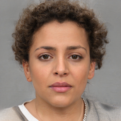 Neutral white young-adult female with short  brown hair and brown eyes