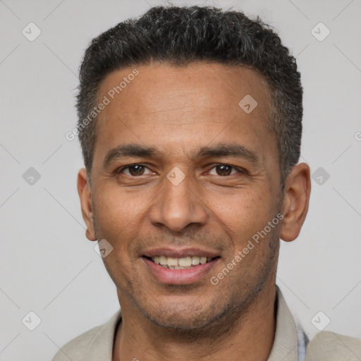 Joyful latino young-adult male with short  brown hair and brown eyes