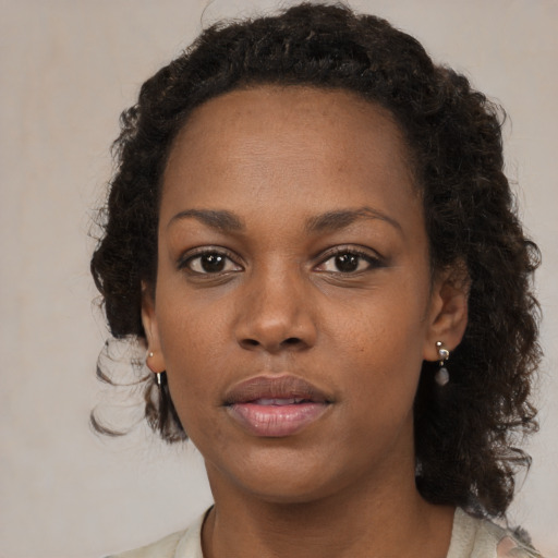 Neutral black young-adult female with medium  brown hair and brown eyes