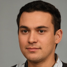 Neutral white young-adult male with short  black hair and brown eyes