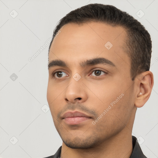 Neutral latino young-adult male with short  black hair and brown eyes