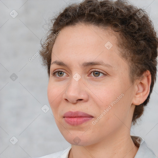 Joyful white adult female with short  brown hair and brown eyes