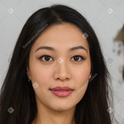 Joyful asian young-adult female with long  brown hair and brown eyes