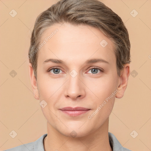 Joyful white young-adult female with short  brown hair and grey eyes