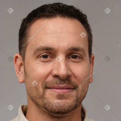 Joyful white adult male with short  brown hair and brown eyes