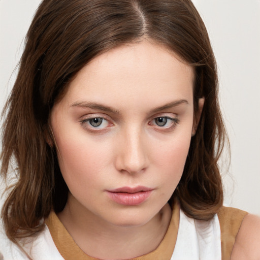 Neutral white young-adult female with medium  brown hair and brown eyes