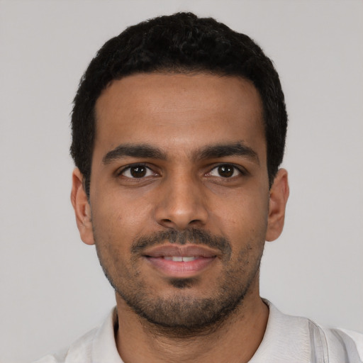 Neutral latino young-adult male with short  black hair and brown eyes