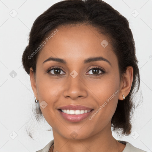 Joyful latino young-adult female with medium  brown hair and brown eyes