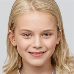 Joyful white child female with long  brown hair and grey eyes