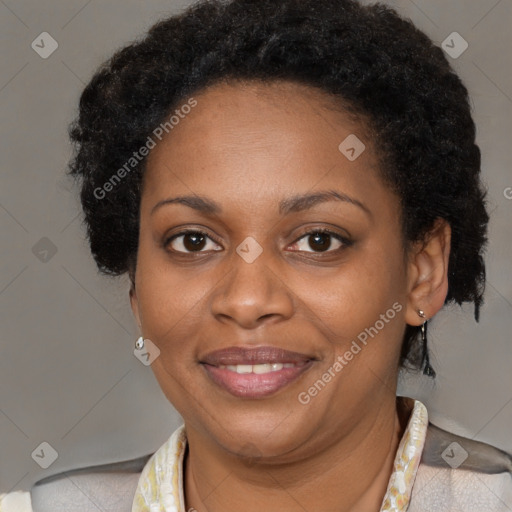 Joyful black adult female with short  brown hair and brown eyes