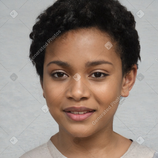 Joyful black child female with short  black hair and brown eyes