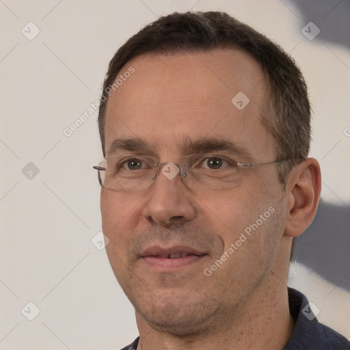 Joyful white adult male with short  brown hair and brown eyes